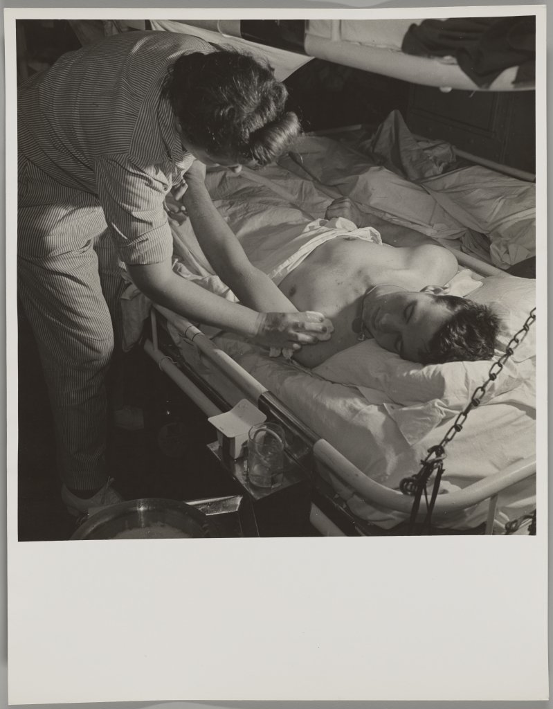 Victor Jorgensen, Untitled, (nurse wiping the shoulder of a patient), 1945.